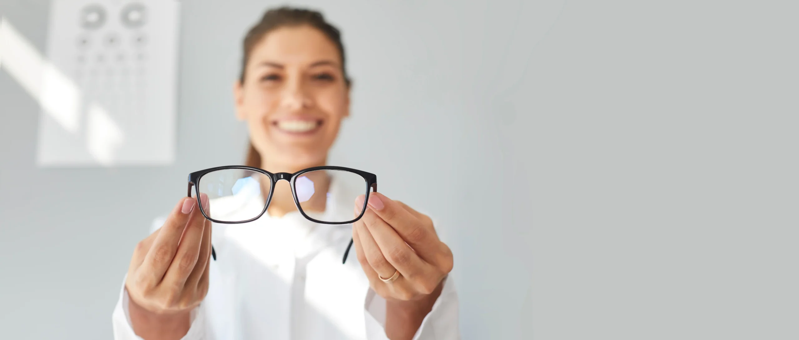 Corneal Cross Linking, Keratoconus, Specialist treatment, woman holding glasses