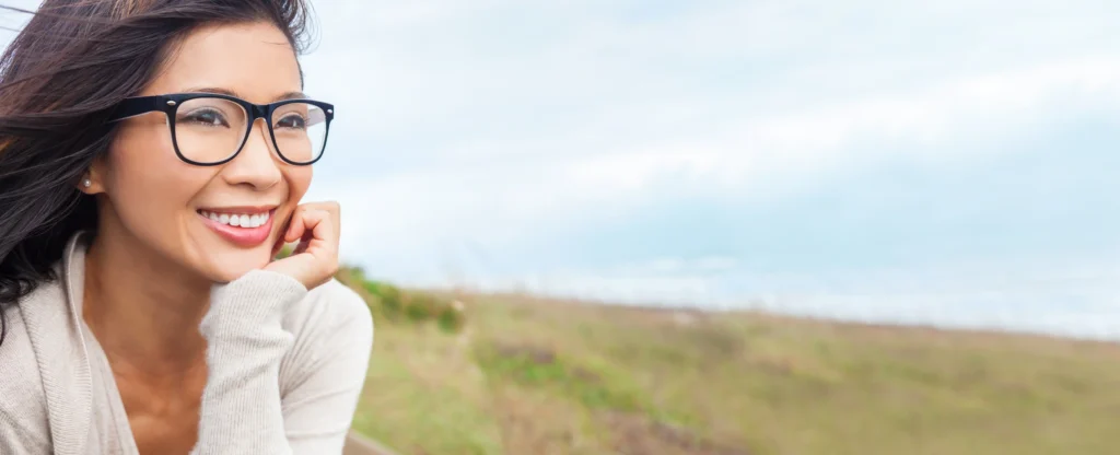 clear vision, keratoconus, laser vision correction, young woman in a field