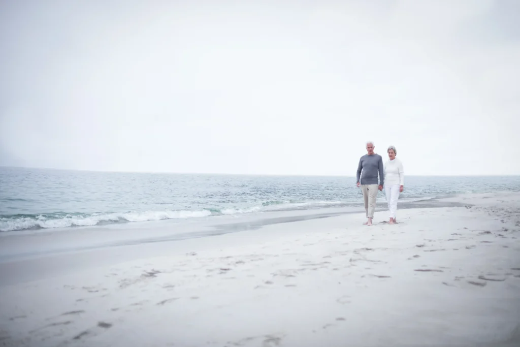 refractive lens exchange, clear lens extraction, older couple on beach